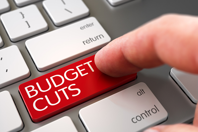 keyboard with "budget cuts" key.