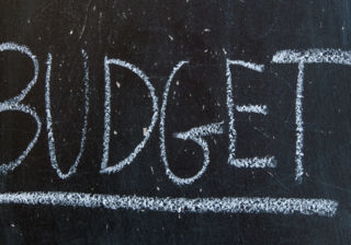 Chalkboard with budget written in chalk school setting.